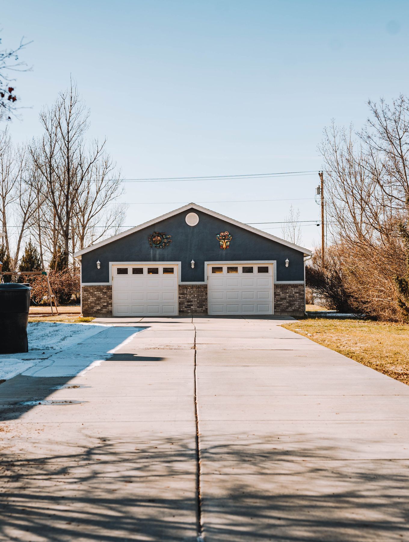 The same style of driveway after powerwashing, with clean, bright concrete